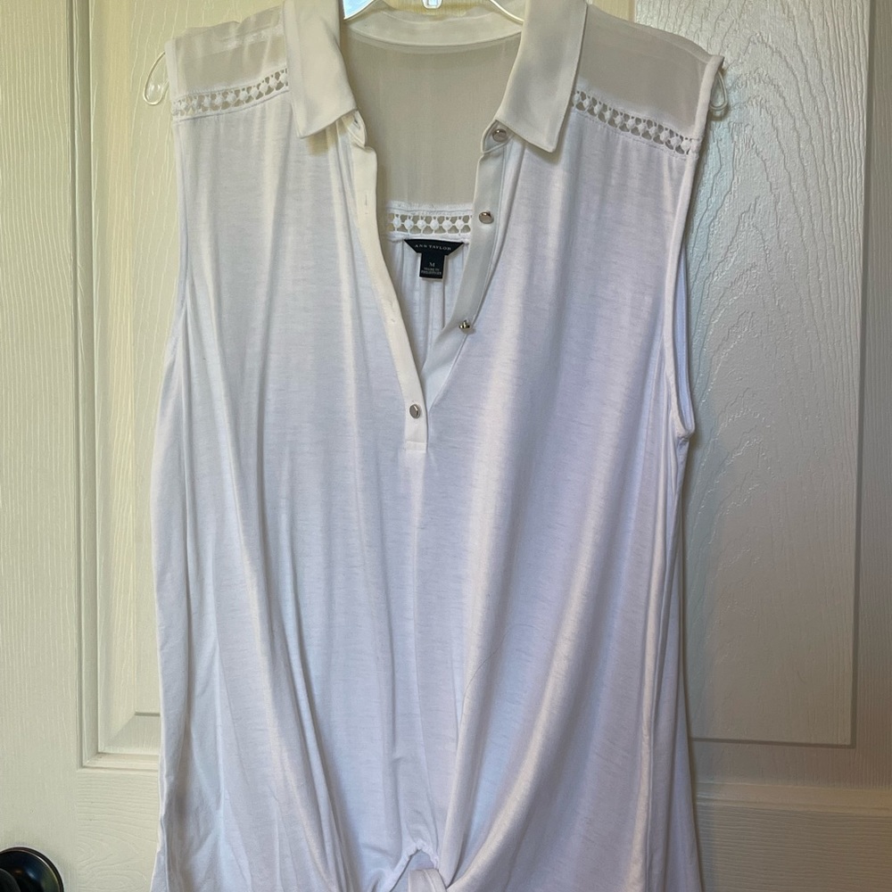 Beautiful sleeveless top with sheer fabric and tie at waist